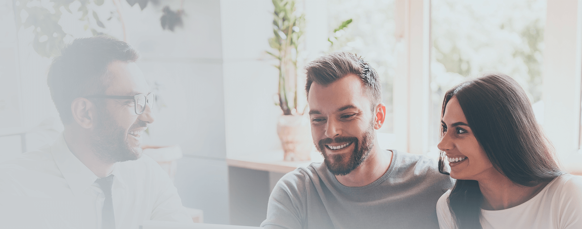 Image showing a smiling couple in a meeting with an adviser