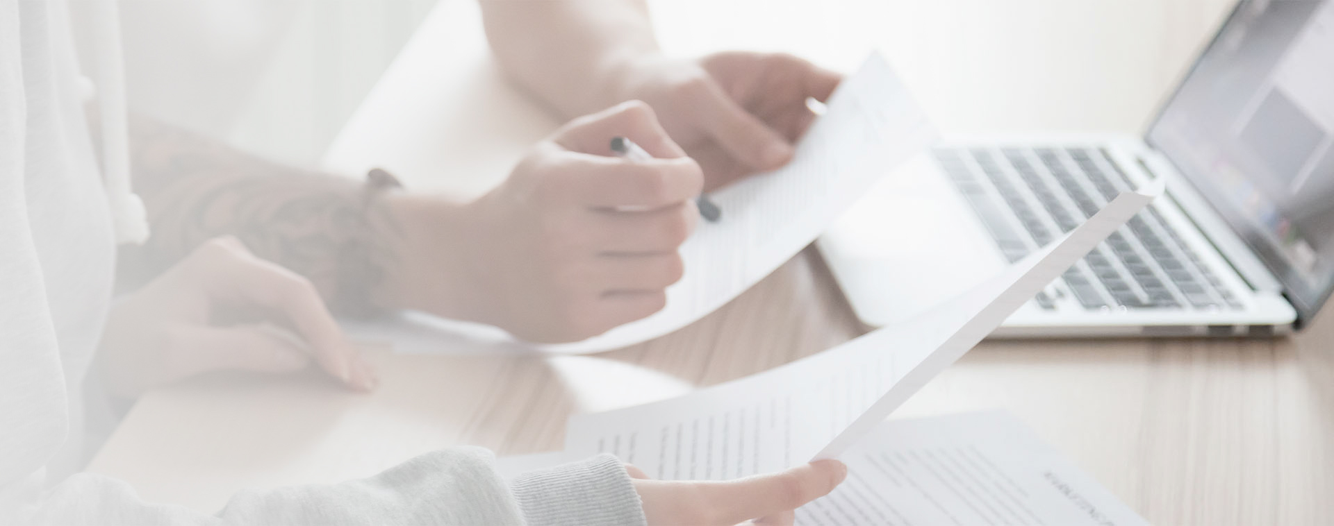 Image showing a close up of a couple signing some paperwork