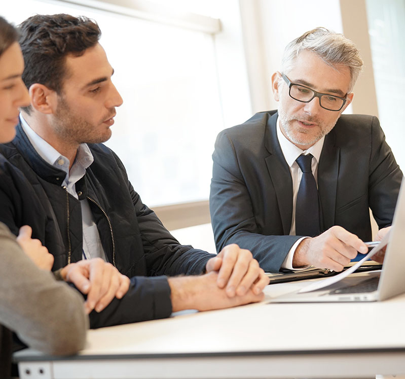 Image showing a couple looking at some paperwork with an adviser