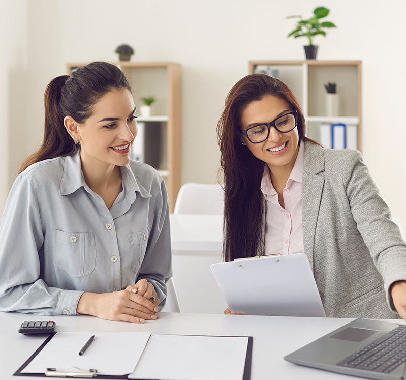 Image showing a woman looking at a laptop with an adviser