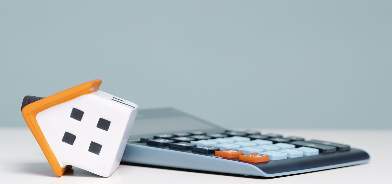 Image showing a model house on a calculator