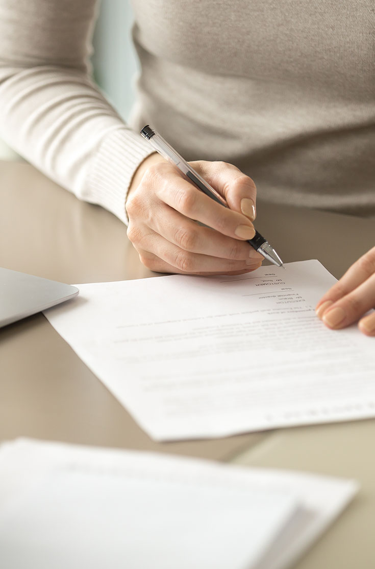 Image showing a close up of a letter being signed