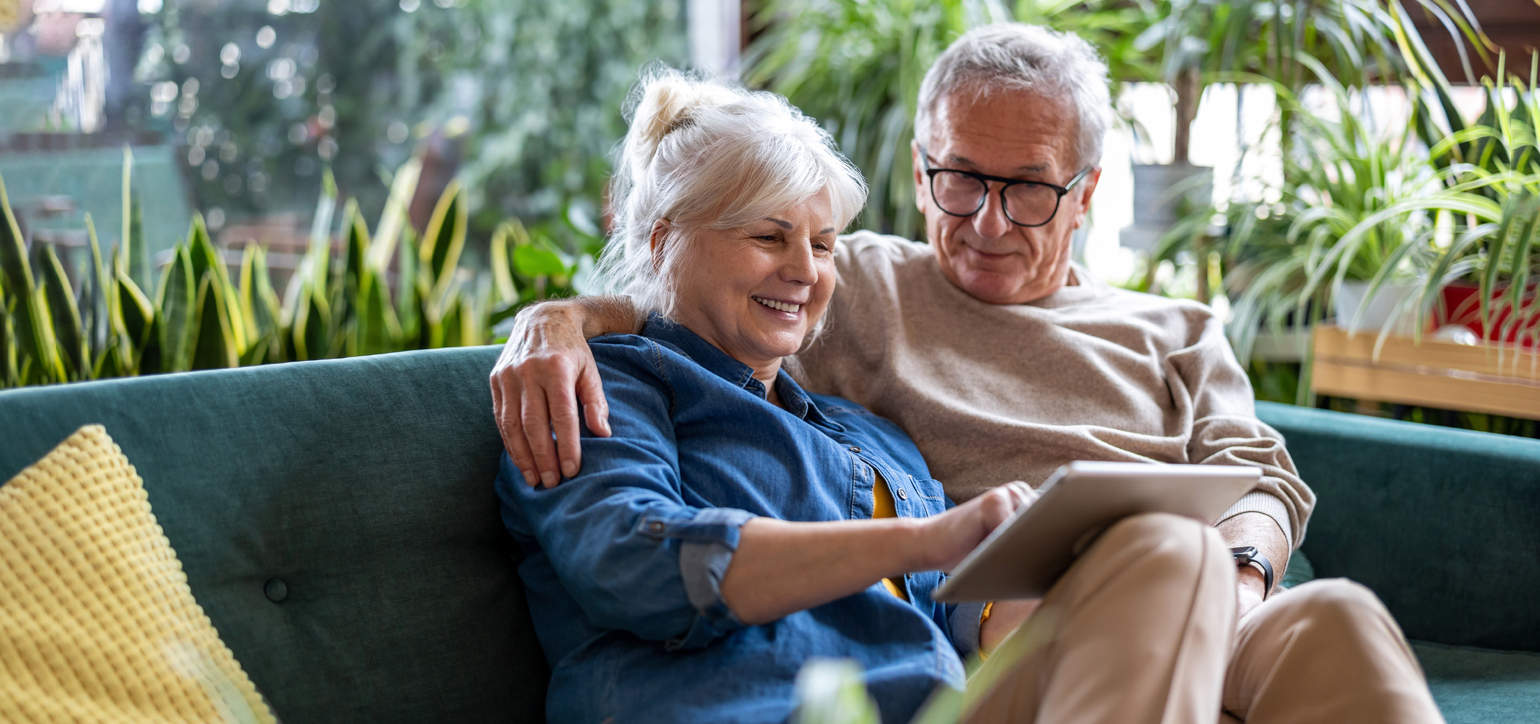 Image showing a happy old couple on the couch
